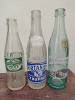 Three 1960s Maltese Soft Drink bottles