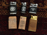 Six old Jack Daniel's lighters
