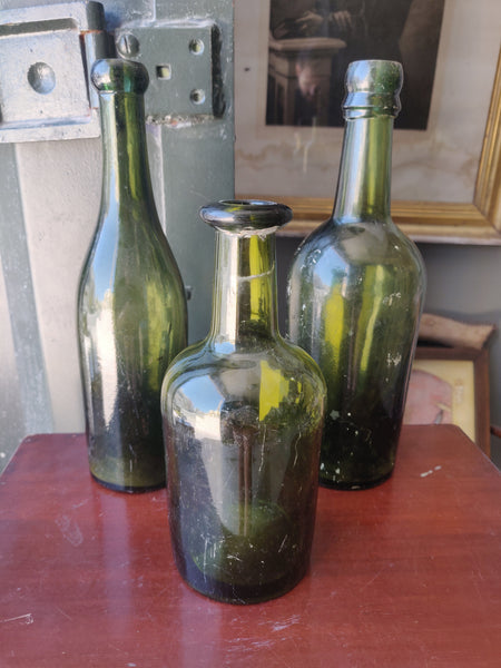Three Antique Green Glass Bottles