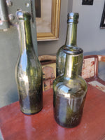 Three Antique Green Glass Bottles